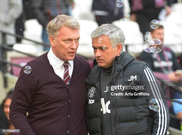 David Moyes of West Ham United chats with opposition manager Jose Mourinho of Manchester United prior to the Premier League match between West Ham...