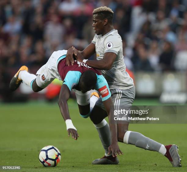 Paul Pogba of Manchester United in action with Cheikhou Kouyate of West Ham United during the Premier League match between West Ham United and...