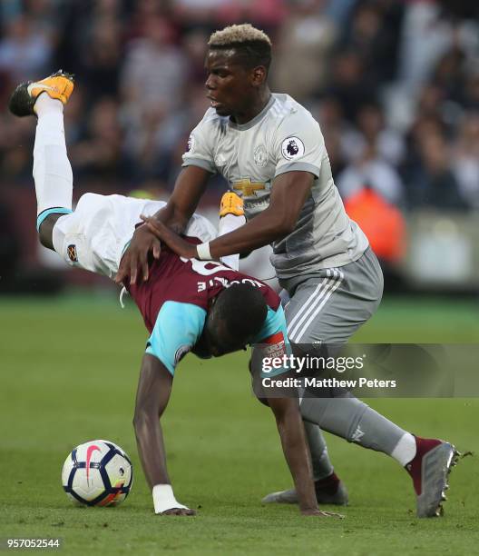 Paul Pogba of Manchester United in action with Cheikhou Kouyate of West Ham United during the Premier League match between West Ham United and...
