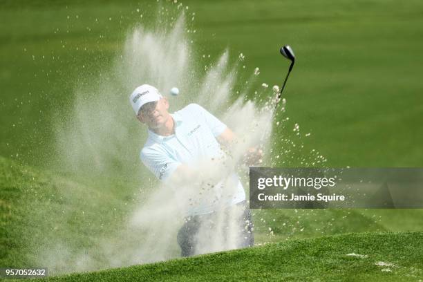 Brendan Steele of the United States plays his third shot from a bunker on the ninth hole during the first round of THE PLAYERS Championship on the...