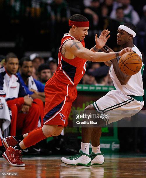 Mike Bibby of the Atlanta Hawks tries to get around Rajon Rondo of the Boston Celtics at the TD Garden on January 11, 2010 in Boston, Massachusetts....