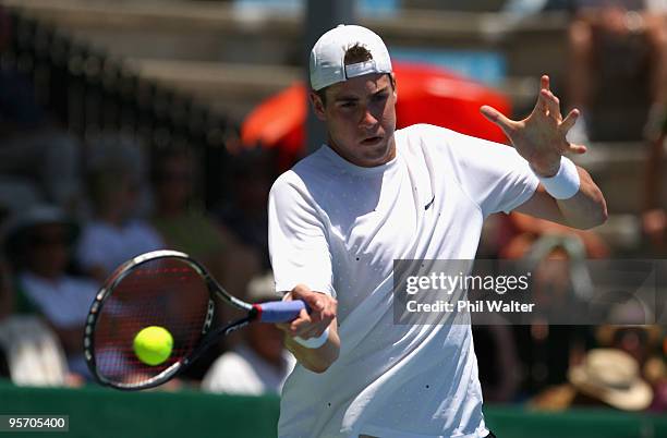 John Isner of the USA plays a forehand during his first round singles match against Guillermo Garcia-Lopez of Spain during day two of the Heineken...