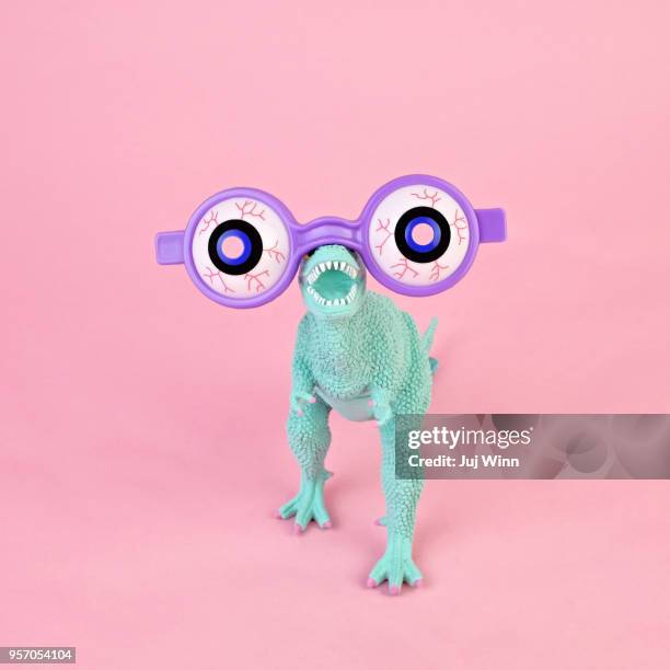 Toy dinosaur with spooky glasses