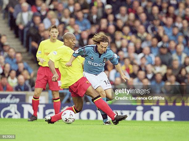 Eyal Berkovic of Manchester City is tackled by Micah Hyde of Watford during the Nationwide Division One match against Watford played at Maine Road,...