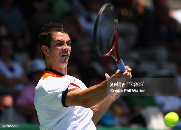 Guillermo Garcia-Lopez of Spain plays a forehand during his first round singles match against John Isner of the USA during day two of the Heineken...