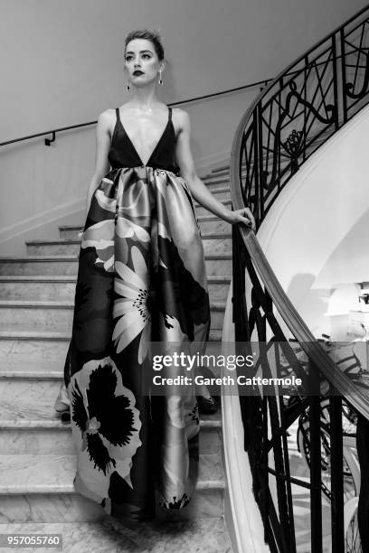 Amber Heard departs the Martinez Hotel during the 71st annual Cannes Film Festival at on May 10, 2018 in Cannes, France.