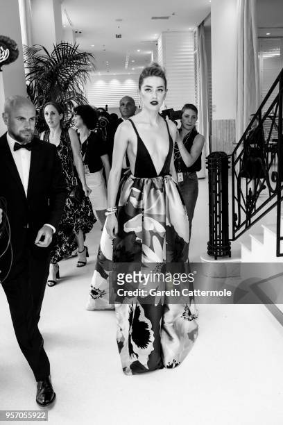 Amber Heard departs the Martinez Hotel during the 71st annual Cannes Film Festival at on May 10, 2018 in Cannes, France.