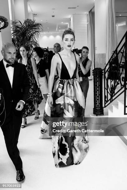 Amber Heard departs the Martinez Hotel during the 71st annual Cannes Film Festival at on May 10, 2018 in Cannes, France.