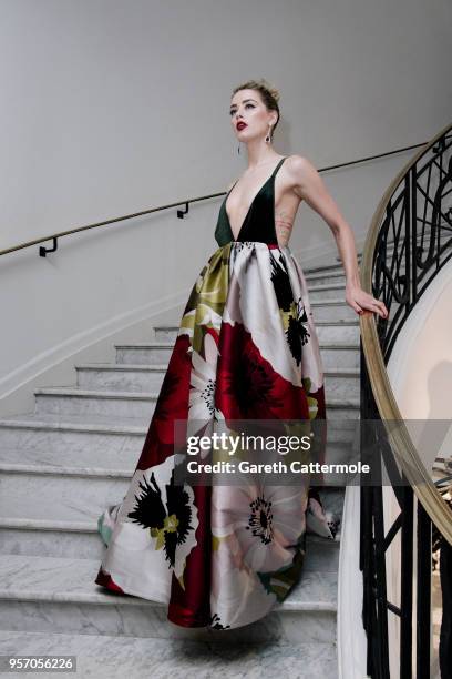 Amber Heard departs the Martinez Hotel during the 71st annual Cannes Film Festival at on May 10, 2018 in Cannes, France.