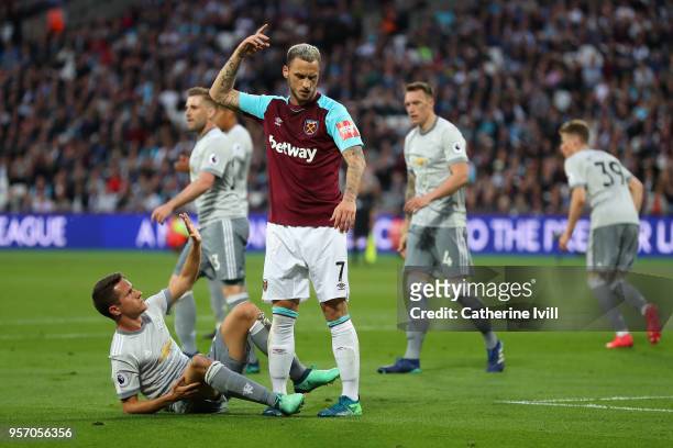 Marko Arnautovic of West Ham United reacts after a challange from Ander Herrera of Manchester United during the Premier League match between West Ham...