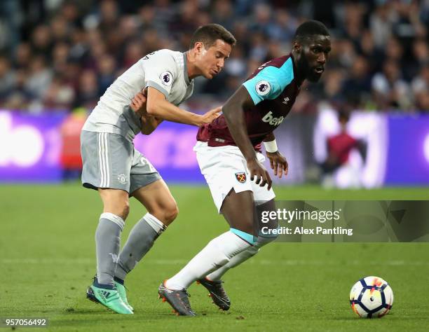 Arthur Masuaku of West Ham United holds off Ander Herrera of Manchester United during the Premier League match between West Ham United and Manchester...