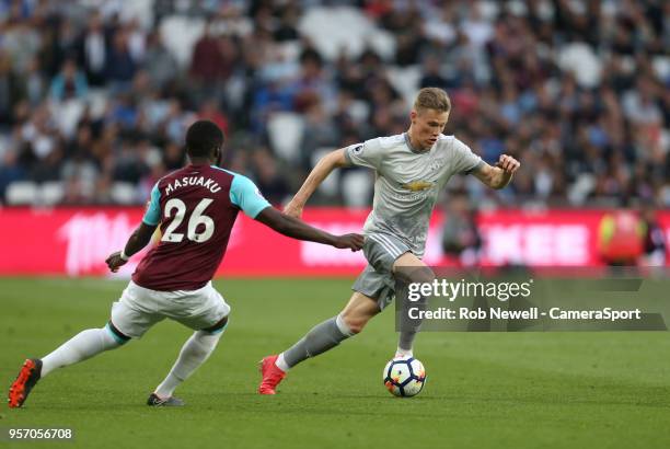 Manchester United's Scott McTominay and West Ham United's Arthur Masuaku during the Premier League match between West Ham United and Manchester...