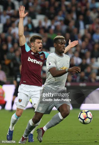 Paul Pogba of Manchester United in action with Aaron Cresswell of West Ham United during the Premier League match between West Ham United and...