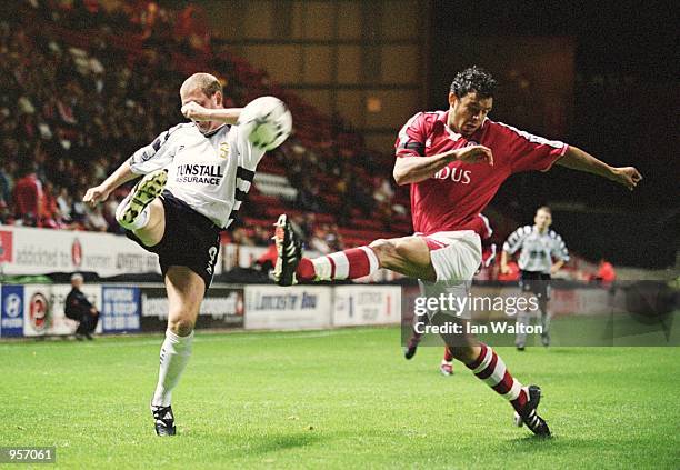 Mark Fish of Charlton attempts to block a Port Vale cross by Stephen Brooker during the Worthington Cup Second Round match between Charlton Athletic...