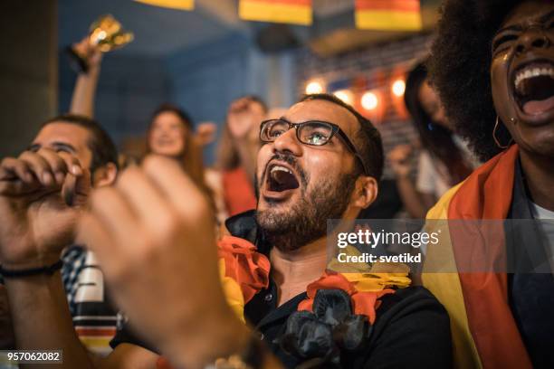 soccer fans cheering - indian football stock pictures, royalty-free photos & images