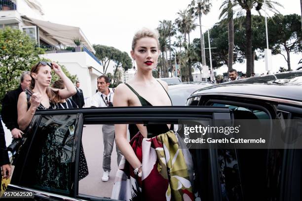 Amber Heard departs the Martinez Hotel during the 71st annual Cannes Film Festival at on May 10, 2018 in Cannes, France.