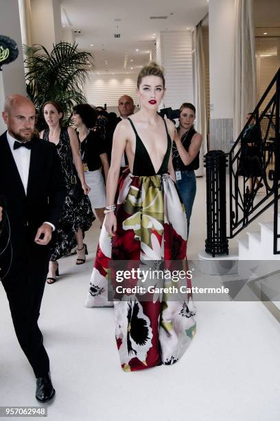 Amber Heard departs the Martinez Hotel during the 71st annual Cannes Film Festival at on May 10, 2018 in Cannes, France.