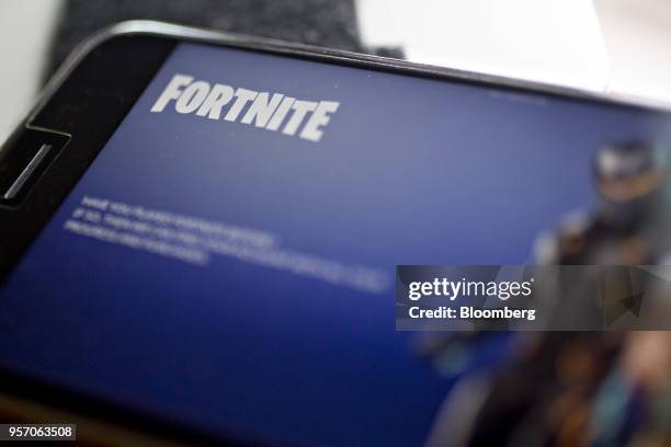 The Epic Games Inc. Fortnite: Battle Royale video game is displayed for a photograph on an Apple Inc. IPhone in Washington, D.C., U.S., on Thursday,...