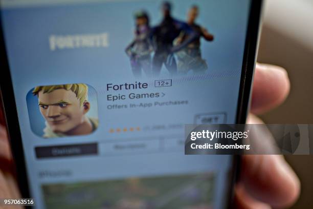 The Epic Games Inc. Fortnite: Battle Royale video game is seen in the App Store on an Apple Inc. IPhone displayed for a photograph in Washington,...