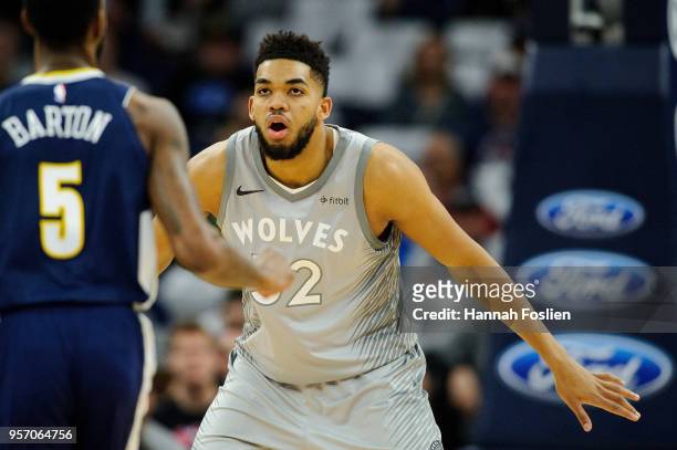 Karl-Anthony Towns of the Minnesota Timberwolves defends against Will Barton of the Denver Nuggets during the game on April 11, 2018 at the Target...
