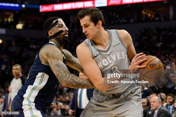 Wilson Chandler of the Denver Nuggets defends against Nemanja Bjelica of the Minnesota Timberwolves during the game on April 11, 2018 at the Target...