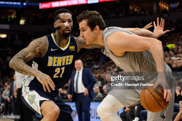 Wilson Chandler of the Denver Nuggets defends against Nemanja Bjelica of the Minnesota Timberwolves during the game on April 11, 2018 at the Target...