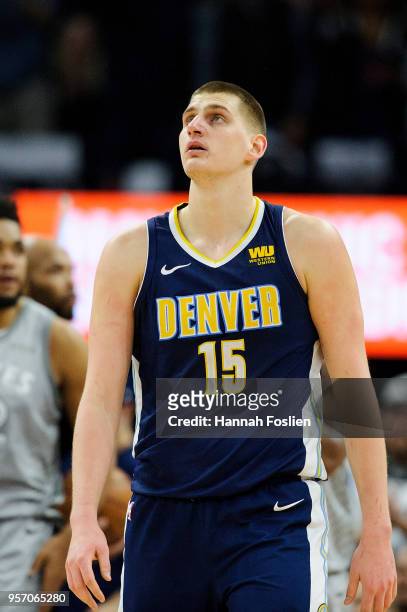 Nikola Jokic of the Denver Nuggets looks on during the game against the Minnesota Timberwolves on April 11, 2018 at the Target Center in Minneapolis,...
