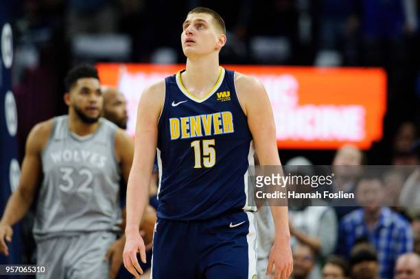 Nikola Jokic of the Denver Nuggets looks on during the game against the Minnesota Timberwolves on April 11, 2018 at the Target Center in Minneapolis,...