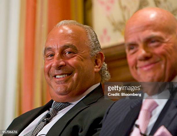 Sir Philip Green, owner of U.K. Retailer Arcadia Group Ltd., left, smiles with Solomon Lew, chairman of Just Group, at the Financo Retail Panel event...
