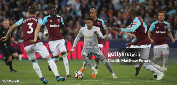 Jesse Lingard of Manchester United in action with Aaron Cresswell, Cheikhou Kouyate, Joao Mario, Declan Rice and Angelo Ogbonna of West Ham United...