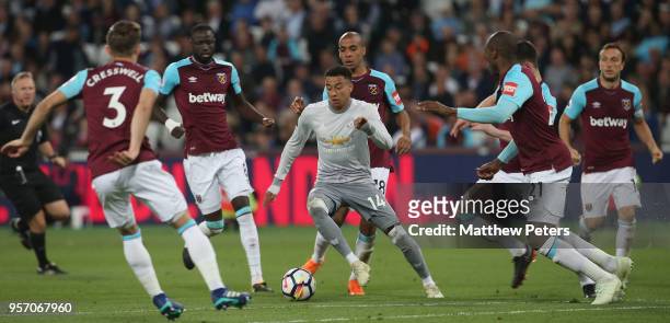 Jesse Lingard of Manchester United in action with Aaron Cresswell, Cheikhou Kouyate, Joao Mario, Declan Rice and Angelo Ogbonna of West Ham United...