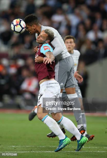 Chris Smalling of Manchester United heads the ball away from Marko Arnautovic of West Ham United during the Premier League match between West Ham...