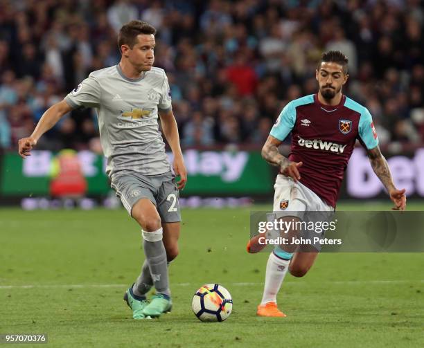 Ander Herrera of Manchester United in action with Manuel Lanzini of West Ham United during the Premier League match between West Ham United and...