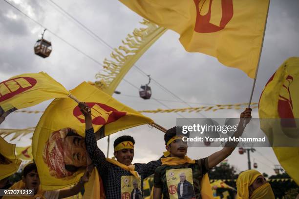 Supporters attend a rally for PDK candidates for Iraqi parliamentary elections at Shanadar park on May 10, 2018 in Erbil, Iraq. Early voting has...