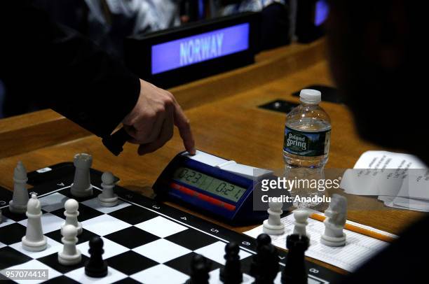 World Chess Champion Magnus Carlsen stops the timer as he plays chess simultaneously with 15 participants from around the world at United Nations...