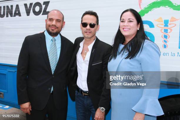 Executive Director of Salud Integral en la Montaña Gloria Del C Amador and Marc Anthony attend an event where "SOMOS + SALUD" delivers state of the...