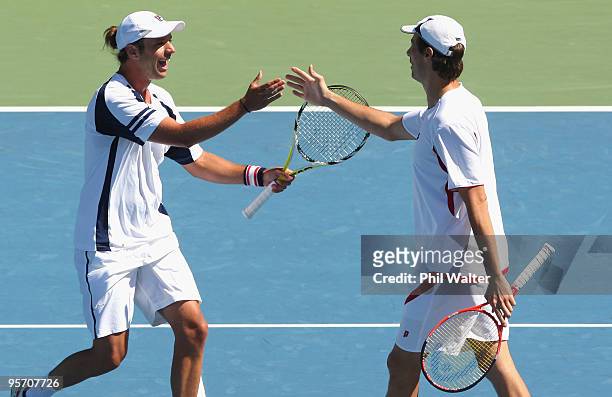 Horacio Zeballos of Argentina and Rogier Wassen of the Netherlands celebrate following their first round doubles match against Bob Bryan and Mike...
