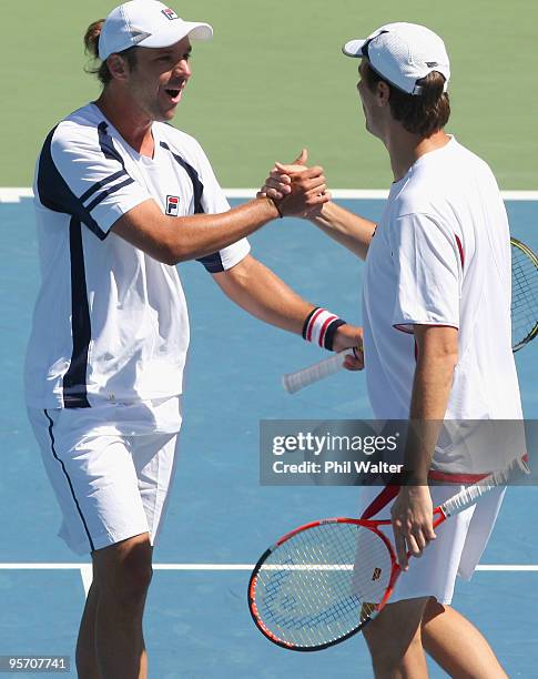 Horacio Zeballos of Argentina and Rogier Wassen of the Netherlands celebrate following their first round doubles match against Bob Bryan and Mike...