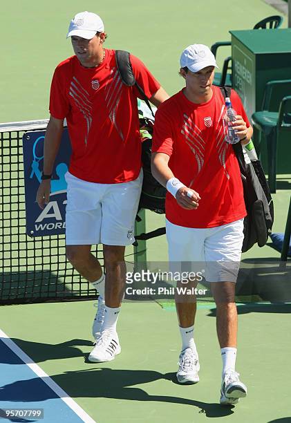 Bob Bryan and Mike Bryan of the USA leave the court after their defeat to Horacio Zeballos of Argentina and Rogier Wassen of the Netherlands in their...