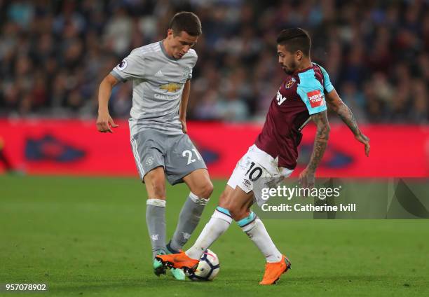 Ander Herrera of Manchester United and Manuel Lanzini of West Ham United battle for possession during the Premier League match between West Ham...