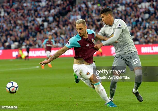 Marko Arnautovic of West Ham United in action with Chris Smalling of Manchester United during the Premier League match between West Ham United and...