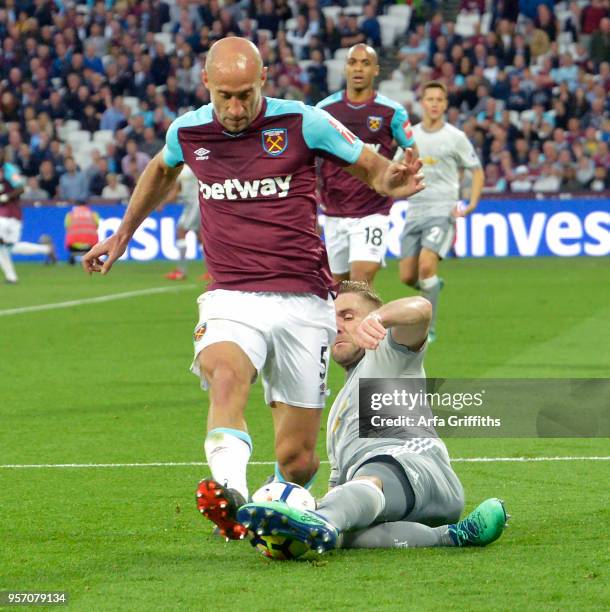 Pablo Zabaleta of West Ham United in action with Luke Shaw of Manchester United during the Premier League match between West Ham United and...