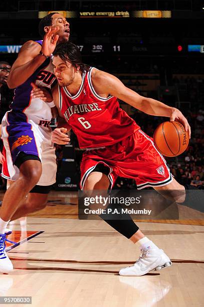 Andrew Bogut of the Milwaukee Bucks drives against Channing Frye of the Phoenix Suns in an NBA Game played on January 11, 2010 at U.S. Airways Center...