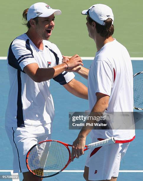 Horacio Zeballos of Argentina and Rogier Wassen of the Netherlands celebrate following their first round doubles match against Bob Bryan and Mike...