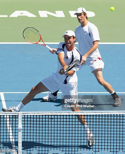 Horacio Zeballos of Argentina plays a volley with support from Rogier Wassen of the Netherlands during their first round doubles match against Bob...