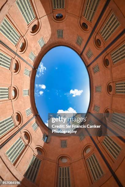 elliptical courtyard inside ferrara's town hall as seen from directly below in ferrara, emilia-romagna, italy - elipse imagens e fotografias de stock