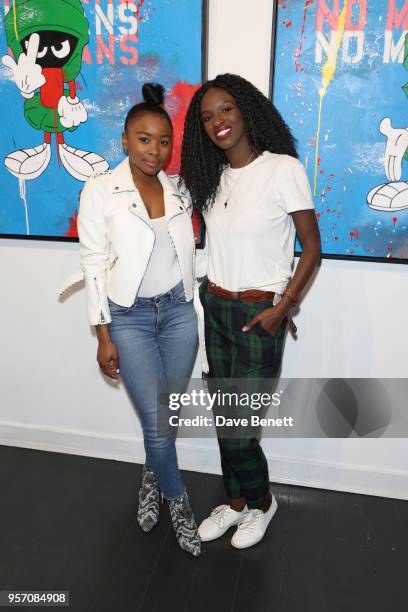 Tinea Taylor and Sarah Mulindwa attend Once Upon A Time by contemporary Irish street artist Robyn Ward on May 10, 2018 in London, England.