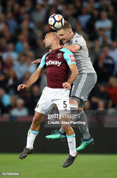 Luke Shaw of Manchester United and Pablo Zabaleta of West Ham United clash during the Premier League match between West Ham United and Manchester...