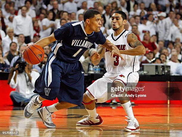 Scottie Reynolds of the Villanova Wildcats dribbles the ball while defended by Peyton Siva of the Louisville Cardinals during the 92-84 Villanova win...