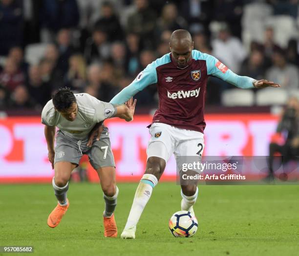 Angelo Ogbonna of West Ham United in action with Alexis Sanchez of Manchester United during the Premier League match between West Ham United and...